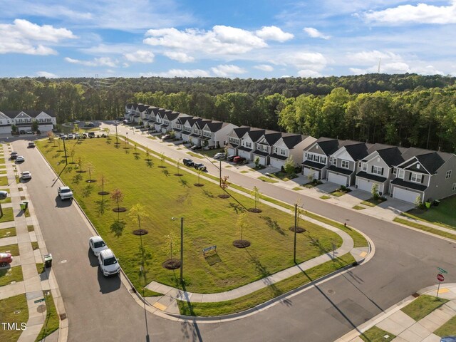 aerial perspective of suburban area with a forest
