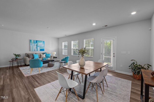 dining area featuring plenty of natural light, wood finished floors, recessed lighting, and baseboards