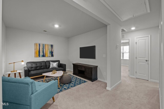 living room featuring attic access, carpet flooring, baseboards, and recessed lighting