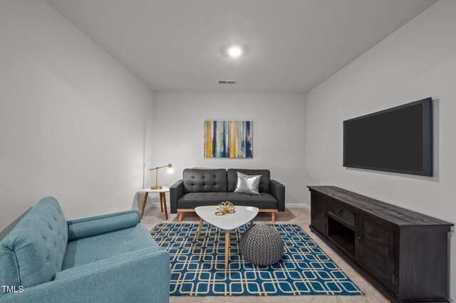 living room with carpet floors and baseboards