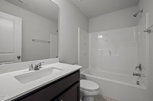 bathroom with toilet, bathtub / shower combination, vanity, and tile patterned flooring
