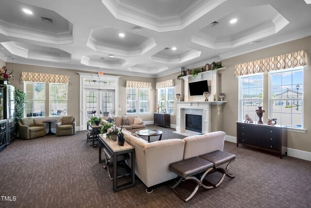 carpeted living room featuring ornamental molding, a fireplace with flush hearth, coffered ceiling, baseboards, and recessed lighting