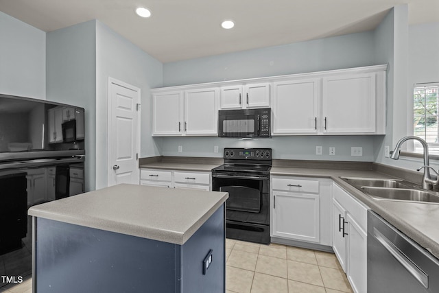 kitchen with a sink, white cabinetry, light tile patterned flooring, and black appliances