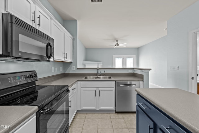 kitchen featuring white cabinets, a sink, a ceiling fan, light tile patterned floors, and black appliances