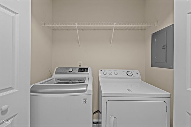 laundry area with separate washer and dryer, laundry area, and electric panel