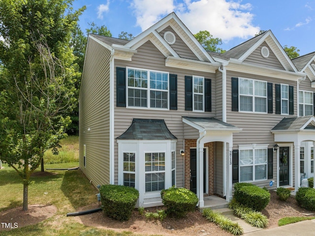 view of property with a front lawn