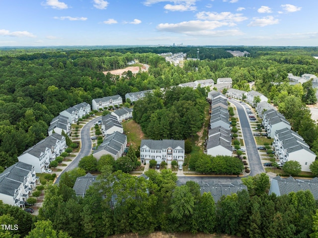 bird's eye view featuring a residential view and a view of trees