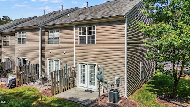 2713 Wyntercrest Ln, Durham, NC 27713 - rear view of house with central air condition unit, fence, and a patio