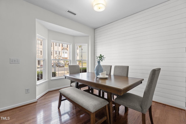 2713 Wyntercrest Ln, Durham, NC 27713 - dining area with visible vents, wood finished floors, and a wealth of natural light