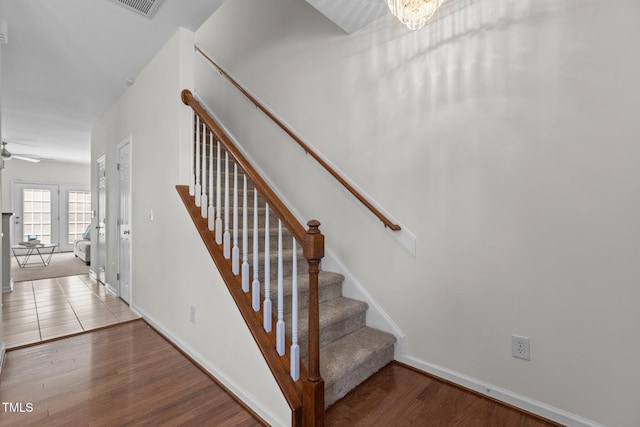 2713 Wyntercrest Ln, Durham, NC 27713 - stairs with baseboards, ceiling fan with notable chandelier, and wood finished floors