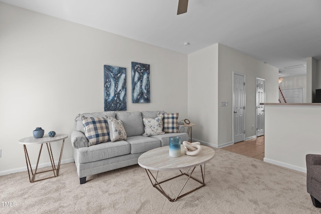 2713 Wyntercrest Ln, Durham, NC 27713 - carpeted living area with a ceiling fan, baseboards, and tile patterned floors