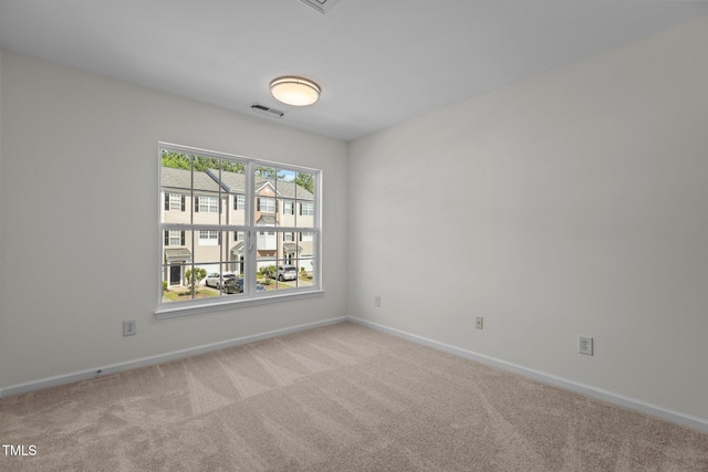2713 Wyntercrest Ln, Durham, NC 27713 - spare room featuring baseboards, light colored carpet, and visible vents