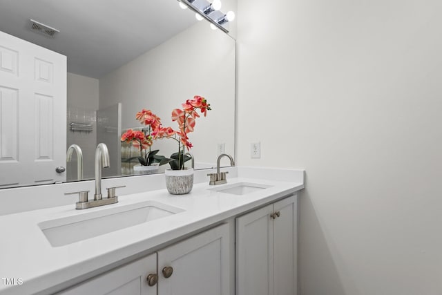 2713 Wyntercrest Ln, Durham, NC 27713 - full bathroom featuring visible vents, a sink, and double vanity