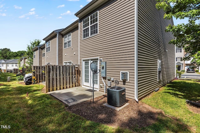 2713 Wyntercrest Ln, Durham, NC 27713 - back of house with a lawn, a patio, a residential view, and central AC unit