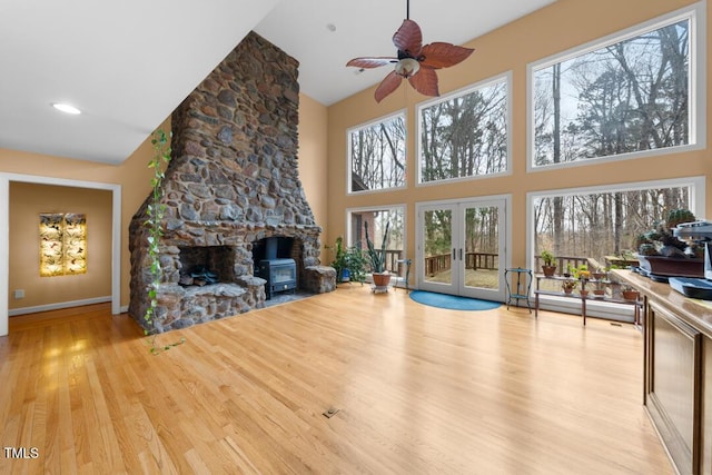 4811 New Sharon Church Rd, Hillsborough, NC 27278 - unfurnished living room with a towering ceiling, healthy amount of natural light, ceiling fan, wood finished floors, and baseboards