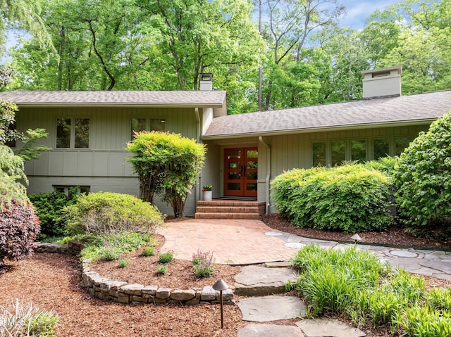 3915 Nottaway Rd, Durham, NC 27707 - view of front of property with a chimney, french doors, and roof with shingles
