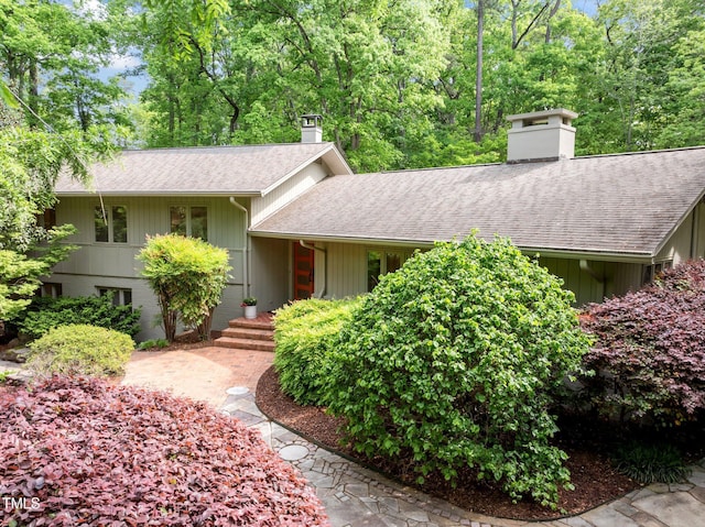 3915 Nottaway Rd, Durham, NC 27707 - view of front facade with a chimney and a shingled roof