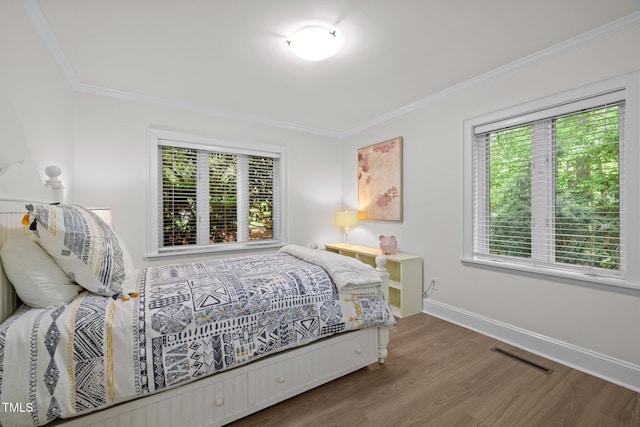 3915 Nottaway Rd, Durham, NC 27707 - bedroom featuring wood finished floors, ornamental molding, and baseboards