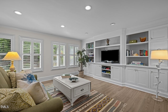 3915 Nottaway Rd, Durham, NC 27707 - living room with crown molding, light wood-type flooring, recessed lighting, and baseboards