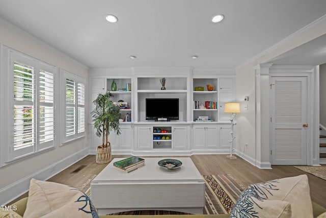 3915 Nottaway Rd, Durham, NC 27707 - living room with light wood finished floors, crown molding, baseboards, and recessed lighting