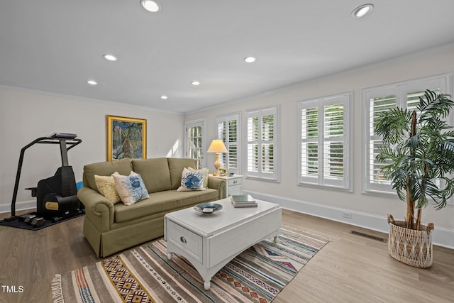 3915 Nottaway Rd, Durham, NC 27707 - living room with recessed lighting, ornamental molding, light wood-style flooring, and baseboards