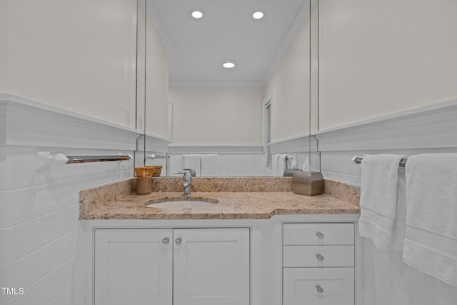 3915 Nottaway Rd, Durham, NC 27707 - bathroom featuring vanity, crown molding, recessed lighting, and tile walls