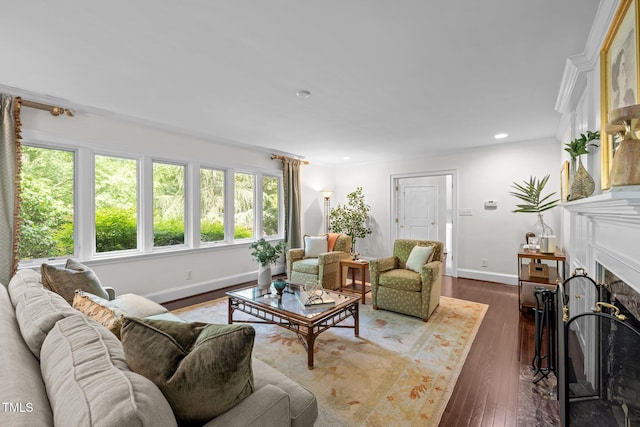3915 Nottaway Rd, Durham, NC 27707 - living area featuring baseboards, a fireplace, dark wood-type flooring, recessed lighting, and ornamental molding
