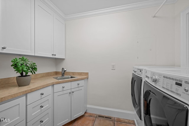 3915 Nottaway Rd, Durham, NC 27707 - laundry room featuring separate washer and dryer, cabinet space, baseboards, and ornamental molding