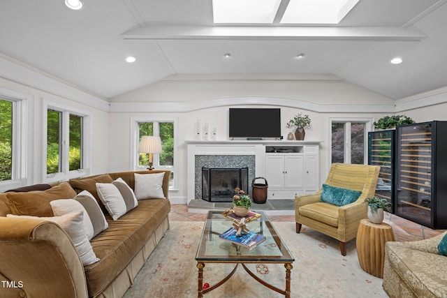 3915 Nottaway Rd, Durham, NC 27707 - living area with vaulted ceiling, a fireplace, a skylight, recessed lighting, and light tile patterned flooring