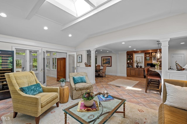 3915 Nottaway Rd, Durham, NC 27707 - living area featuring ornate columns, lofted ceiling, recessed lighting, light tile patterned flooring, and arched walkways