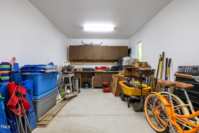 3915 Nottaway Rd, Durham, NC 27707 - kitchen with concrete floors and dark brown cabinetry