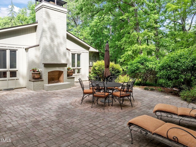 3915 Nottaway Rd, Durham, NC 27707 - view of patio / terrace featuring a large fireplace and outdoor dining space