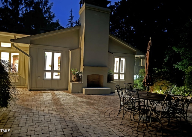 3915 Nottaway Rd, Durham, NC 27707 - patio at twilight featuring a patio area and outdoor dining space