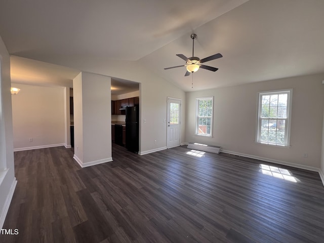 unfurnished living room featuring baseboards, lofted ceiling, a ceiling fan, and dark wood-style flooring