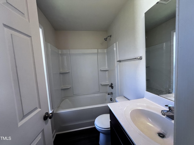 full bathroom featuring visible vents, toilet, vanity, and shower / tub combination