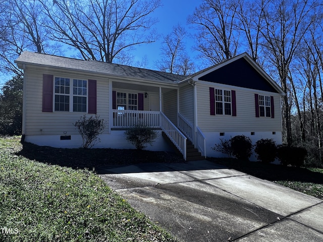ranch-style home with a porch and crawl space