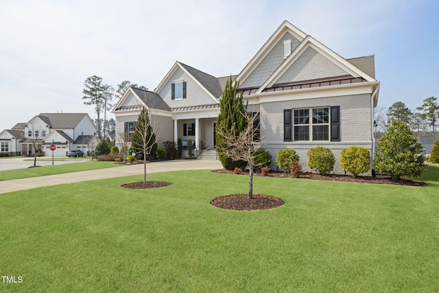 301 Rocking Ranch Ct, Cary, NC 27519 - craftsman inspired home featuring a standing seam roof, concrete driveway, a front yard, and a metal roof