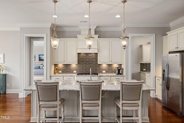 301 Rocking Ranch Ct, Cary, NC 27519 - kitchen featuring stainless steel refrigerator with ice dispenser, dark wood-style flooring, tasteful backsplash, decorative light fixtures, and light stone countertops