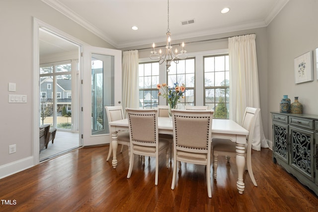 301 Rocking Ranch Ct, Cary, NC 27519 - dining space with plenty of natural light, a chandelier, dark wood-style floors, ornamental molding, and recessed lighting