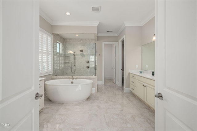 301 Rocking Ranch Ct, Cary, NC 27519 - full bathroom with vanity, tiled shower, crown molding, a freestanding bath, and marble finish floors