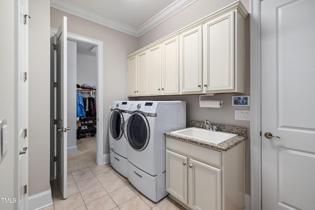 301 Rocking Ranch Ct, Cary, NC 27519 - laundry room with washing machine and clothes dryer, cabinet space, ornamental molding, and light tile patterned floors