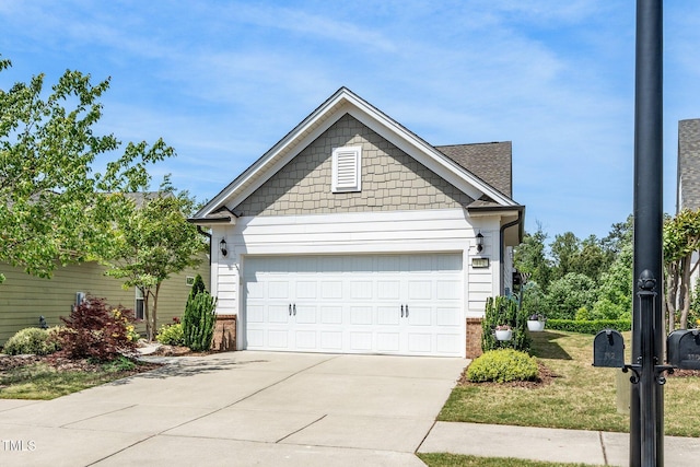 view of front of home with brick siding, driveway, and a garage