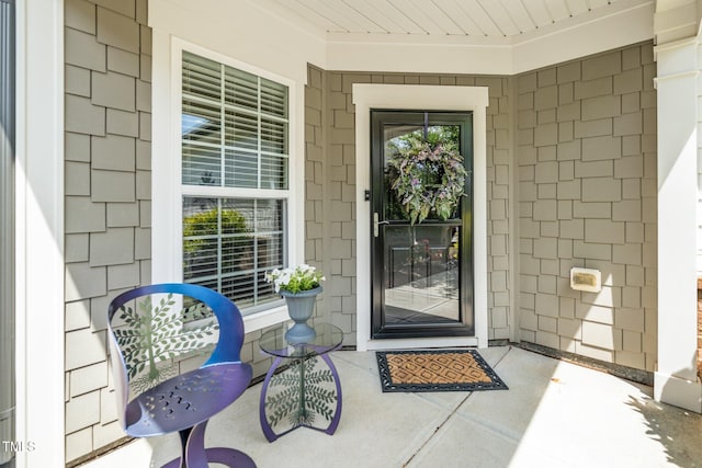 doorway to property with covered porch