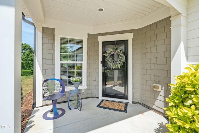 property entrance featuring covered porch