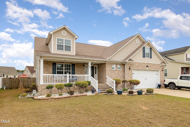 8404 Frenchorn Ln, Fayetteville, NC 28314 - view of front of house featuring brick siding, covered porch, concrete driveway, and a front yard