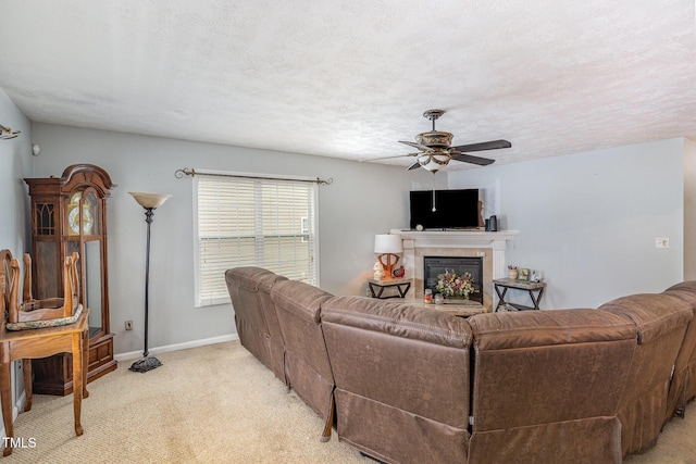 8404 Frenchorn Ln, Fayetteville, NC 28314 - living room featuring light colored carpet, a fireplace, a ceiling fan, and a textured ceiling