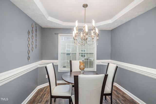 8404 Frenchorn Ln, Fayetteville, NC 28314 - dining room with a tray ceiling, crown molding, a notable chandelier, and wood finished floors