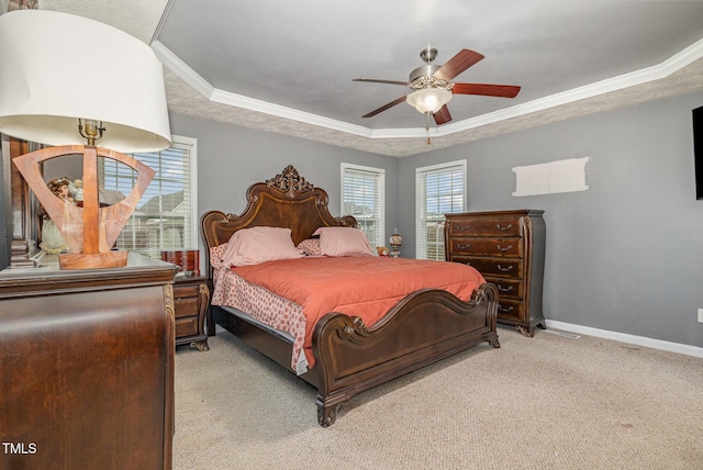 8404 Frenchorn Ln, Fayetteville, NC 28314 - bedroom featuring a tray ceiling, baseboards, light carpet, and ornamental molding