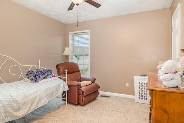8404 Frenchorn Ln, Fayetteville, NC 28314 - carpeted bedroom with visible vents, baseboards, a textured ceiling, and a ceiling fan