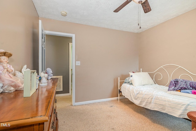 8404 Frenchorn Ln, Fayetteville, NC 28314 - carpeted bedroom with visible vents, ceiling fan, a textured ceiling, and baseboards